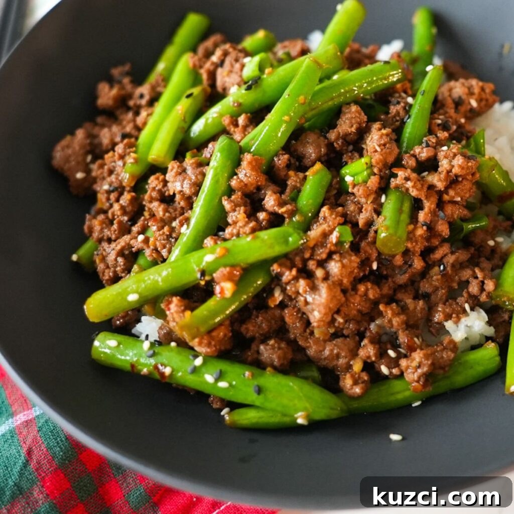 Ground Beef Stir Fry Recipe with Vegetables 4 Ground beef stir fry in a bowl on top of rice.