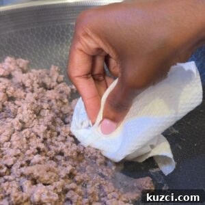 Ground Beef Stir Fry Recipe with Vegetables 6 Ground beef browned and excess liquid being removed.