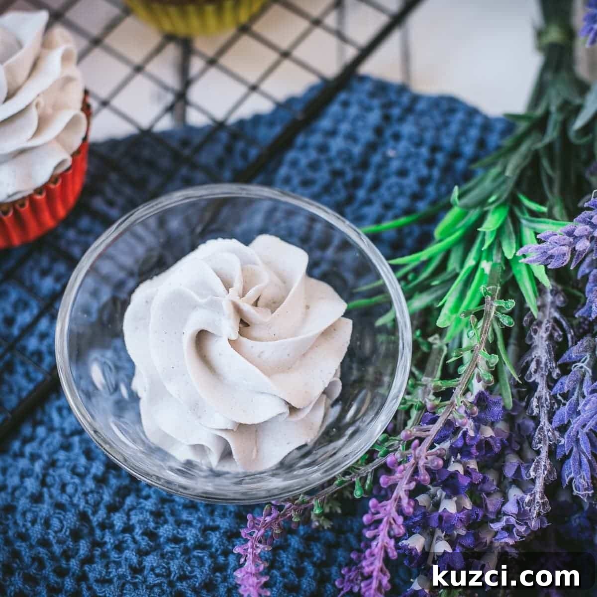 Lavender buttercream piped into a glass jar.