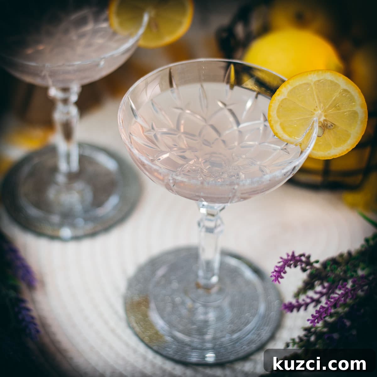 Lavender gin spritz cocktail with Prosecco and lemon garnish.