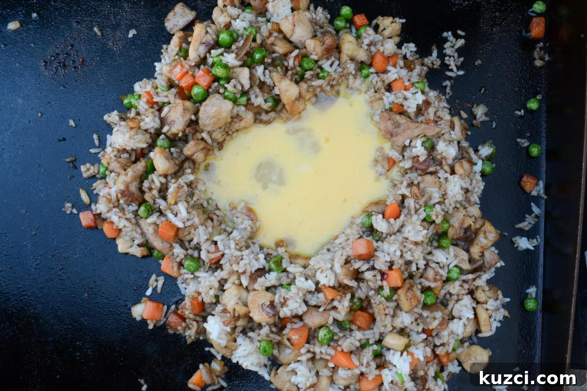 Blackstone Chicken Fried Rice Recipe 11 adding egg to blackstone chicken fried rice