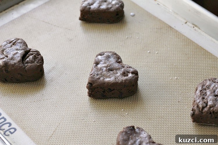 Chocolate Biscuits and Strawberry Butter recipe Heart shaped chocolate biscuits on baking pan