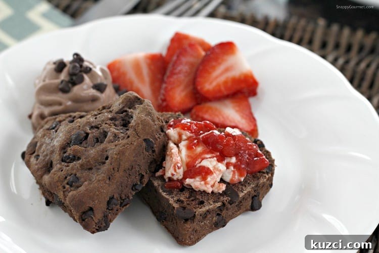 Chocolate Biscuits with Homemade Strawberry Butter - delicious from scratch biscuits Chocolate Chocolate Chip Biscuits cut open with homemade Strawberry Butter