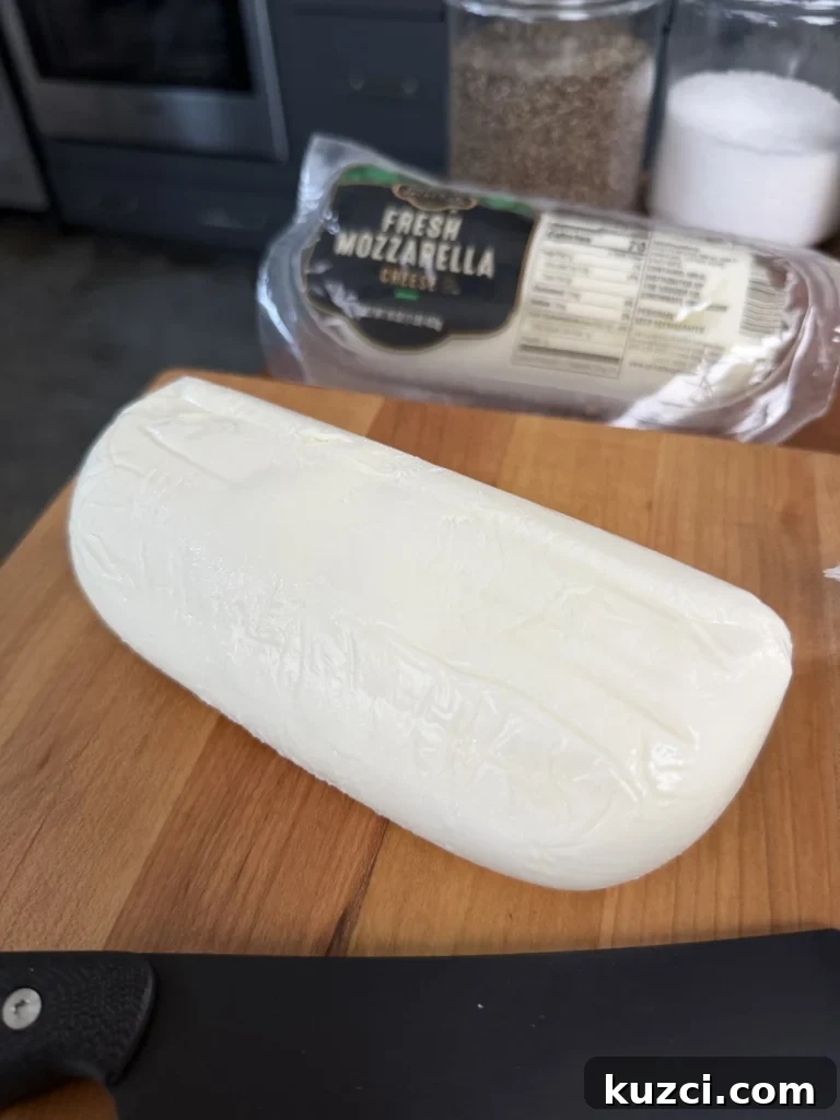Crispy Chicken Parmesan Sandwich Recipe 5 Fresh mozzarella on a wooden cutting board