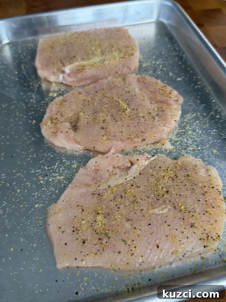 Crispy Chicken Parmesan Sandwich Recipe 7 Butterflied chicken on a metal tray