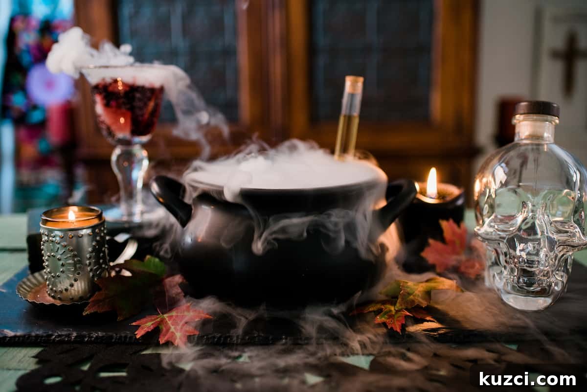 Witches' Brew Sangria: Spooky Halloween Cocktail 7 Black witch’s cauldron overflowing with dry ice fog beside a lit black candle, a skull-shaped liquor bottle, and a goblet of sangria.