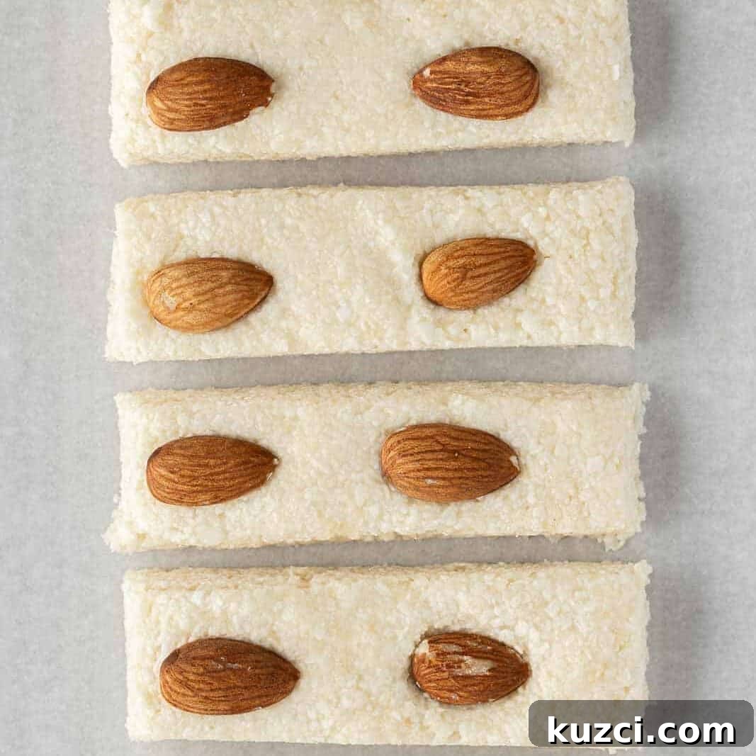 No-Bake Coconut Chocolate Bar Recipe 6 The set candy bar filling is cut into individual bars.