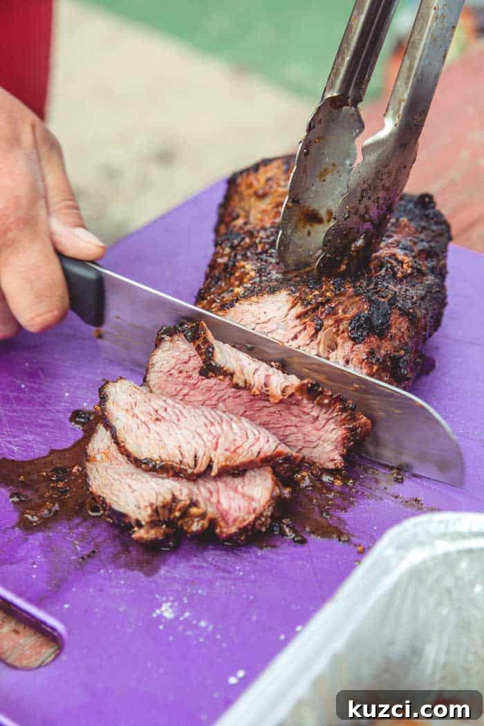 Smoked Tri-Tip: Brine Recipes, Wood Choices & Cooking Temps 3 smoked tri-tip sliced on chopping board
