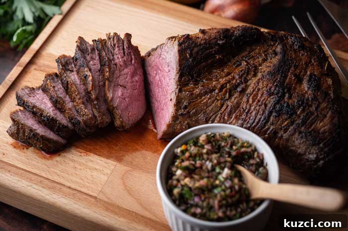 Smoked Tri-Tip: Brine Recipes, Wood Choices & Cooking Temps 4 smoked tri tip served on chopping board with chimichurri