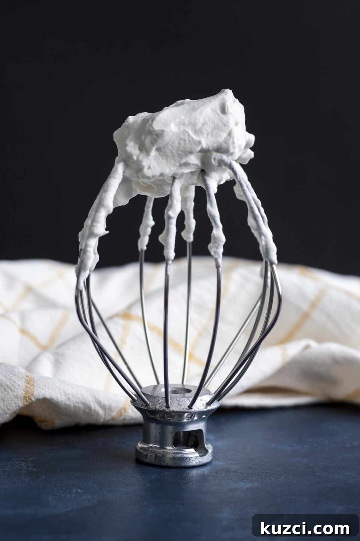 Homemade Whipped Cream Recipe in 5 Minutes 4 Homemade whipped cream whipped until stiff peaks, on a wire whip.