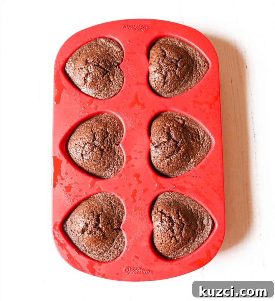 Keto Chocolate Flaxseed Muffins Recipe 4 Keto Chocolate Flaxseed Muffins overhead shot in a heart red silicone muffin pan