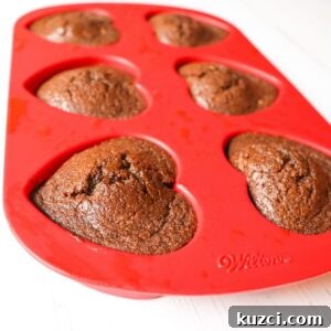 Keto Chocolate Flaxseed Muffins in red heart silicone baking pan side view