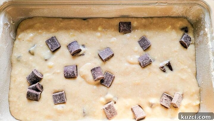 chocolate chunk banana bread batter in a loaf pan.