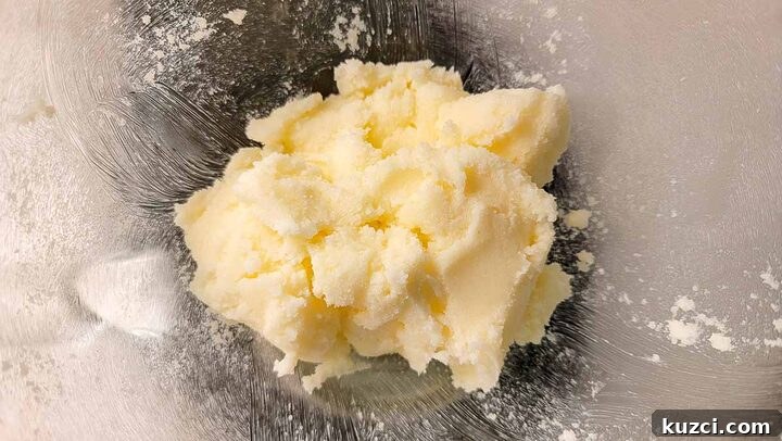 butter and sugar creamed in a mixing bowl.
