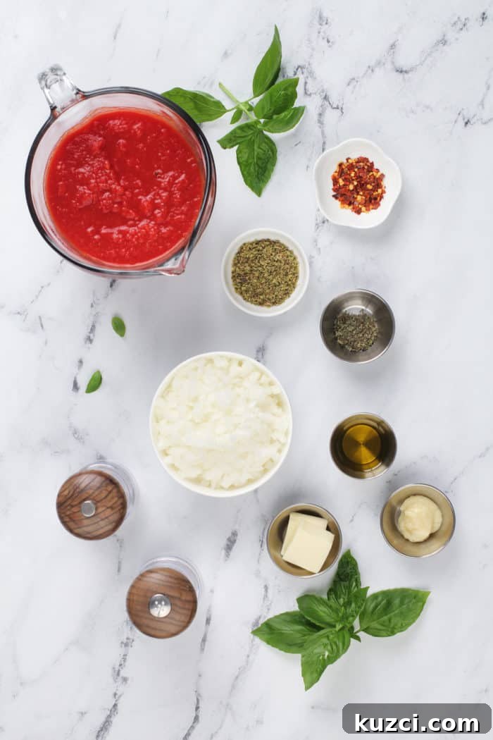 15-Minute Homemade Marinara Sauce for Pasta 4 Ingredients for quick marinara sauce arranged on a marble countertop.