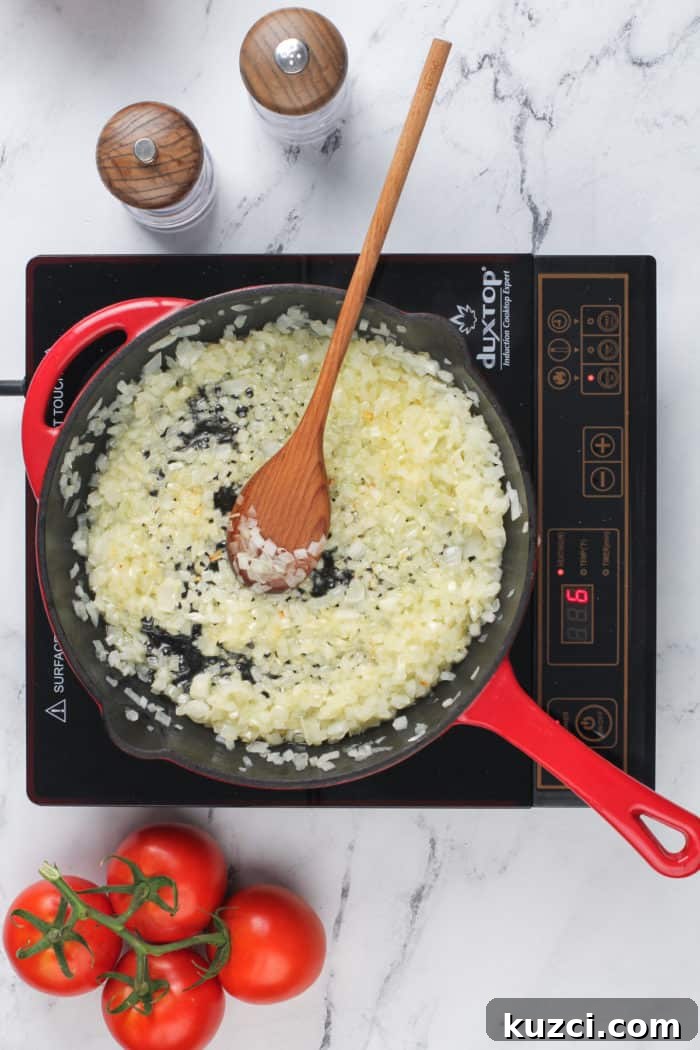 15-Minute Homemade Marinara Sauce for Pasta 5 Onions being cooked in a cast iron skillet.