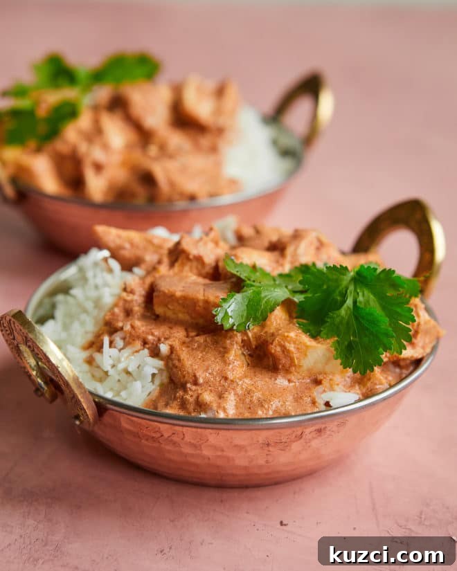 Turn One Roasted Chicken into 2 Weeknight Dinners 4 a copper bowl of Indian-inspired butter chicken over white rice