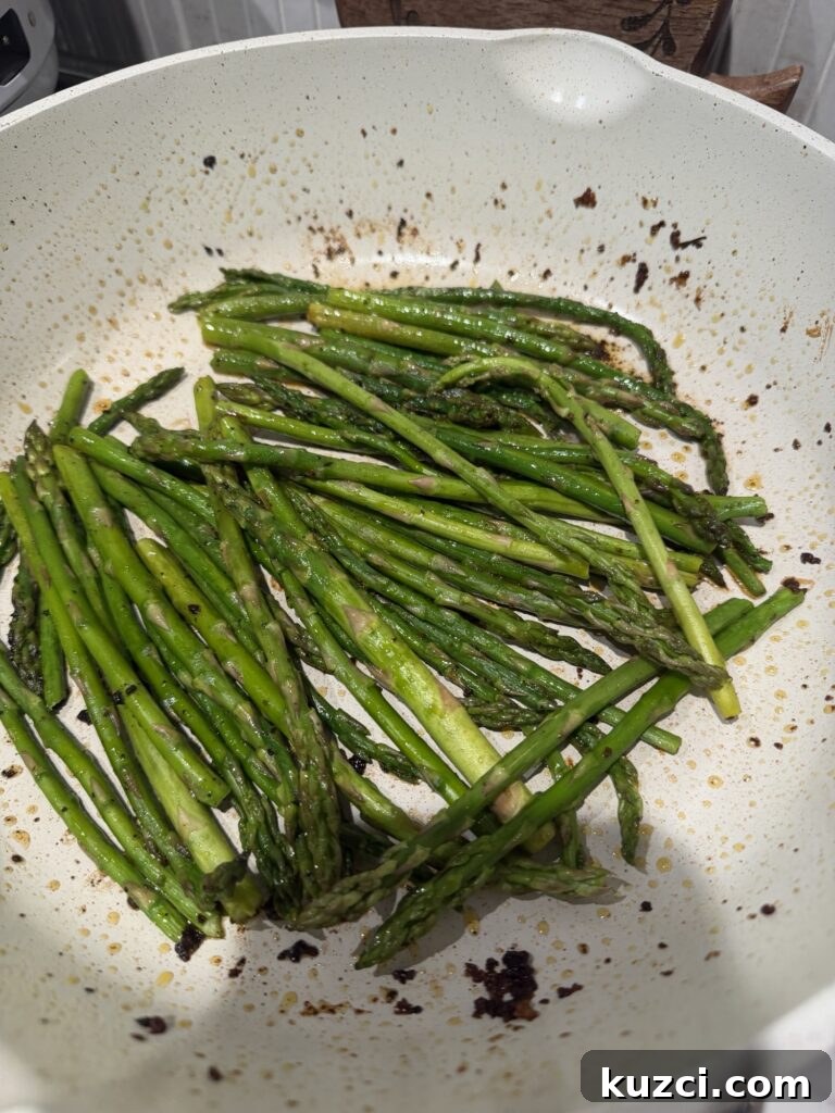 Chicken Asparagus Croissant Casserole 6 Asparagus cooking in the pan