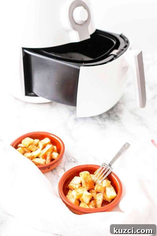Crispy Air Fryer Patatas Bravas with Spicy Tomato Sauce 2 Patatas bravas made in an Air Fryer. It's super easy to make and a great snack or side dish.