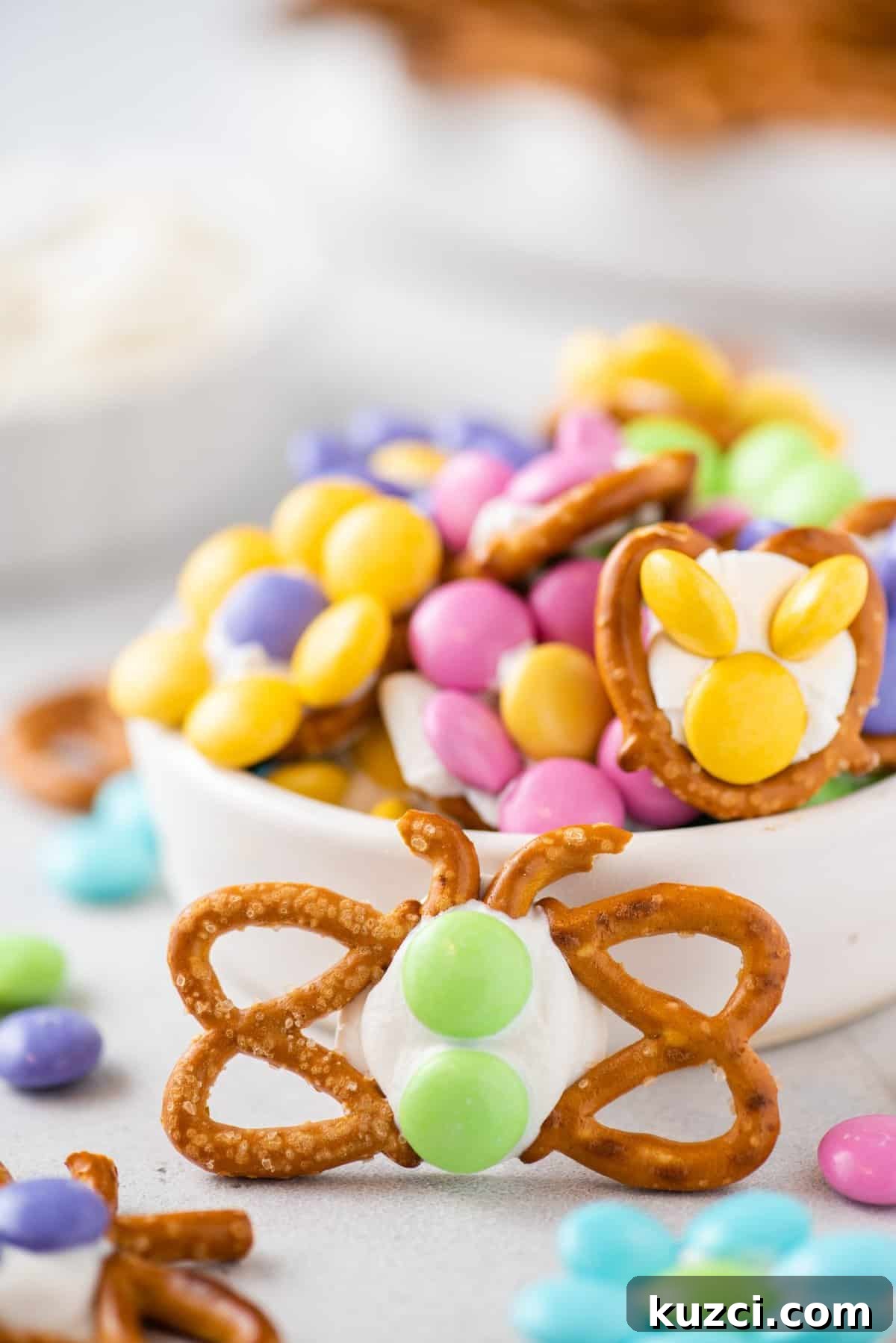 Festive Easter Pretzels: Soft Baked Twists and Decorating Ideas 4 pretzel butterfly propped up on white dish