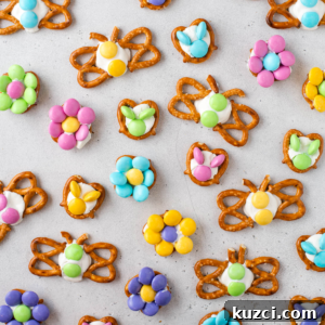 Festive Easter Pretzels: Soft Baked Twists and Decorating Ideas 9 Colorful spring-themed Easter pretzels made with white icing and pastel candies, arranged in butterfly and flower shapes, make delightful Easter treats on a light gray surface.