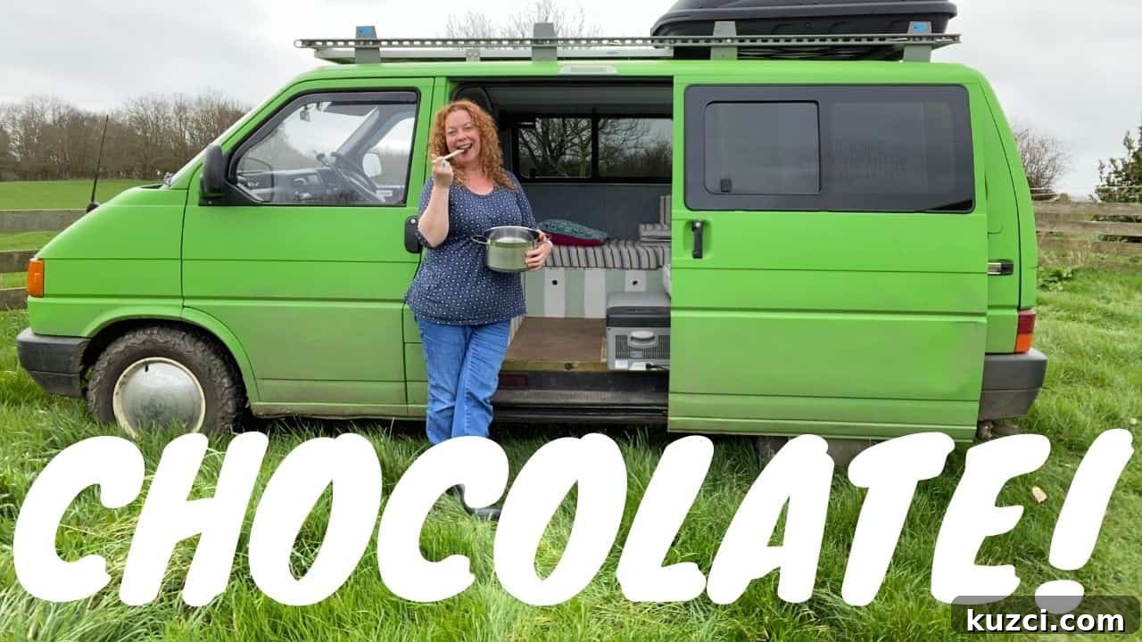 No-Bake Chocolate Cornflake Cakes Recipe 12 woman with red hair wearing blue clothes stood in front of a bright green campervan licking a a chocolate coated spoon