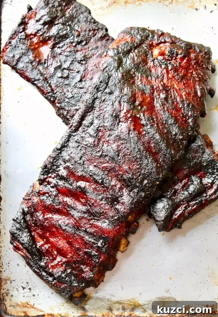 Two slabs of cooked St. Louis style ribs.