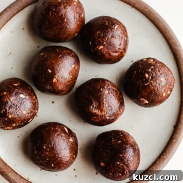 Chocolate Almond Butter Protein Balls Recipe 13 Protein balls on a rustic plate.