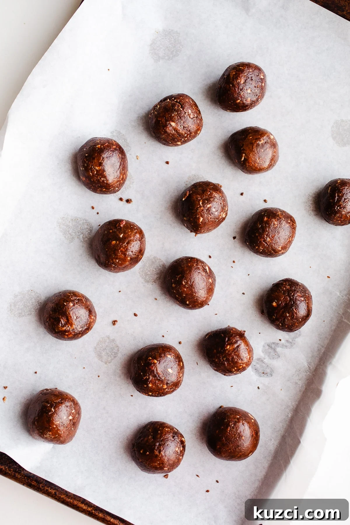 Chocolate Almond Butter Protein Balls Recipe 7 Protein balls on a baking sheet.