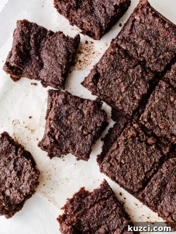 Chocolate brownie bars on parchment paper.