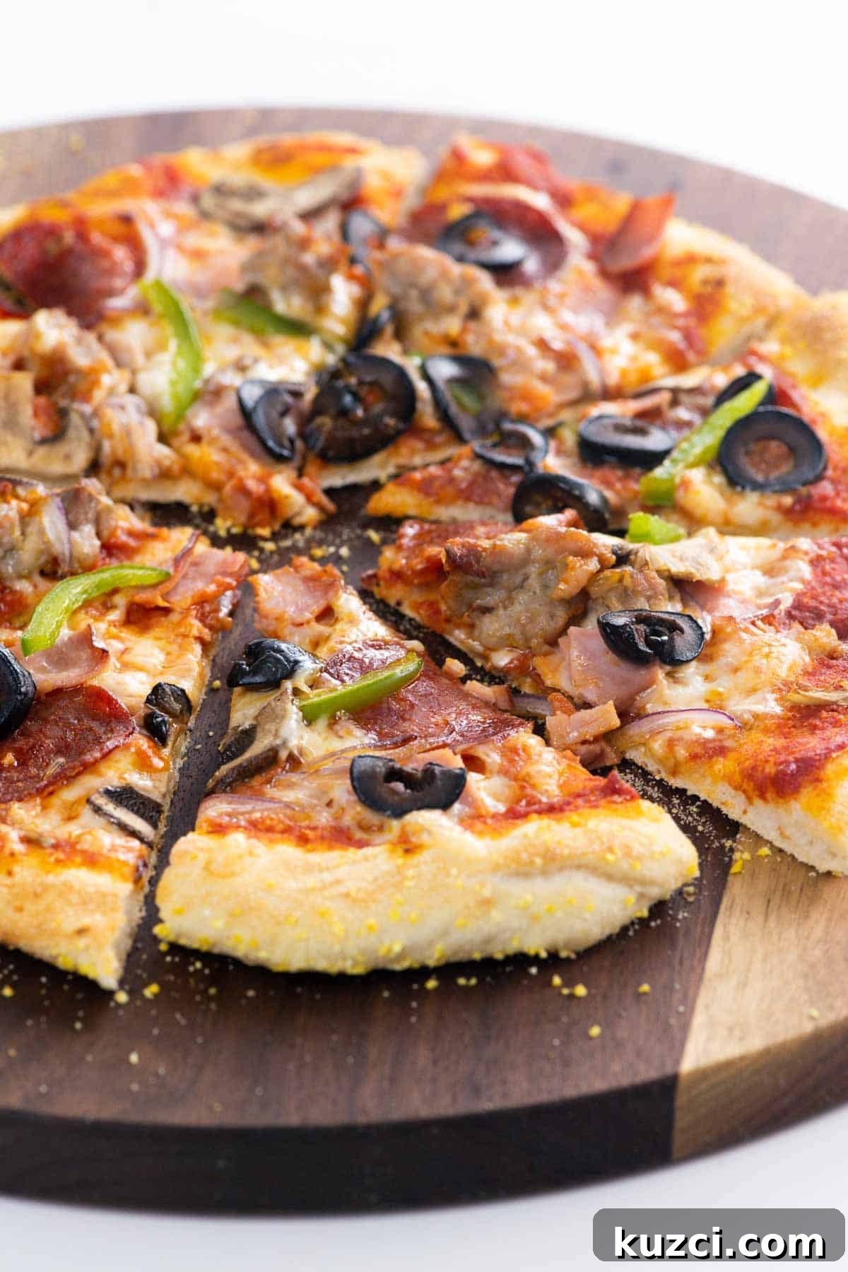 a supreme pizza on a cutting board