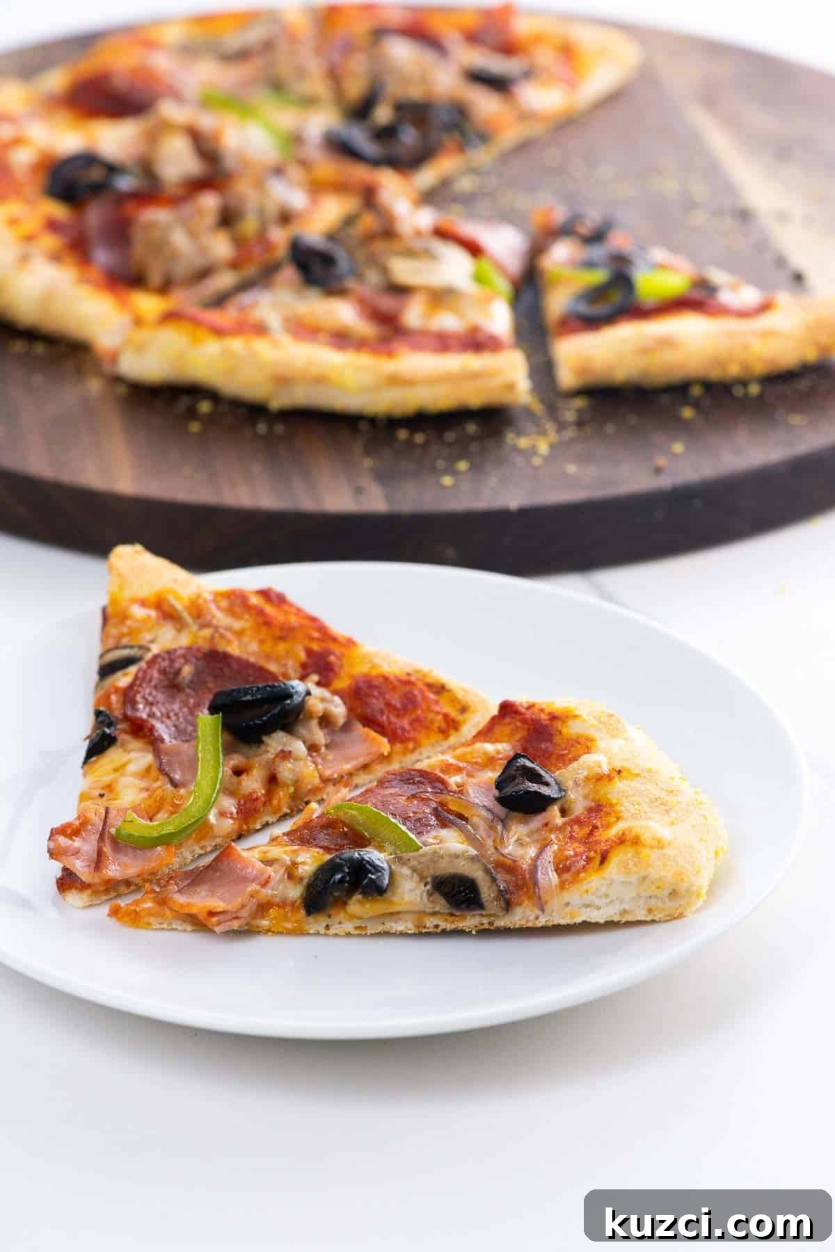 slices of supreme pizza on a plate and cutting board