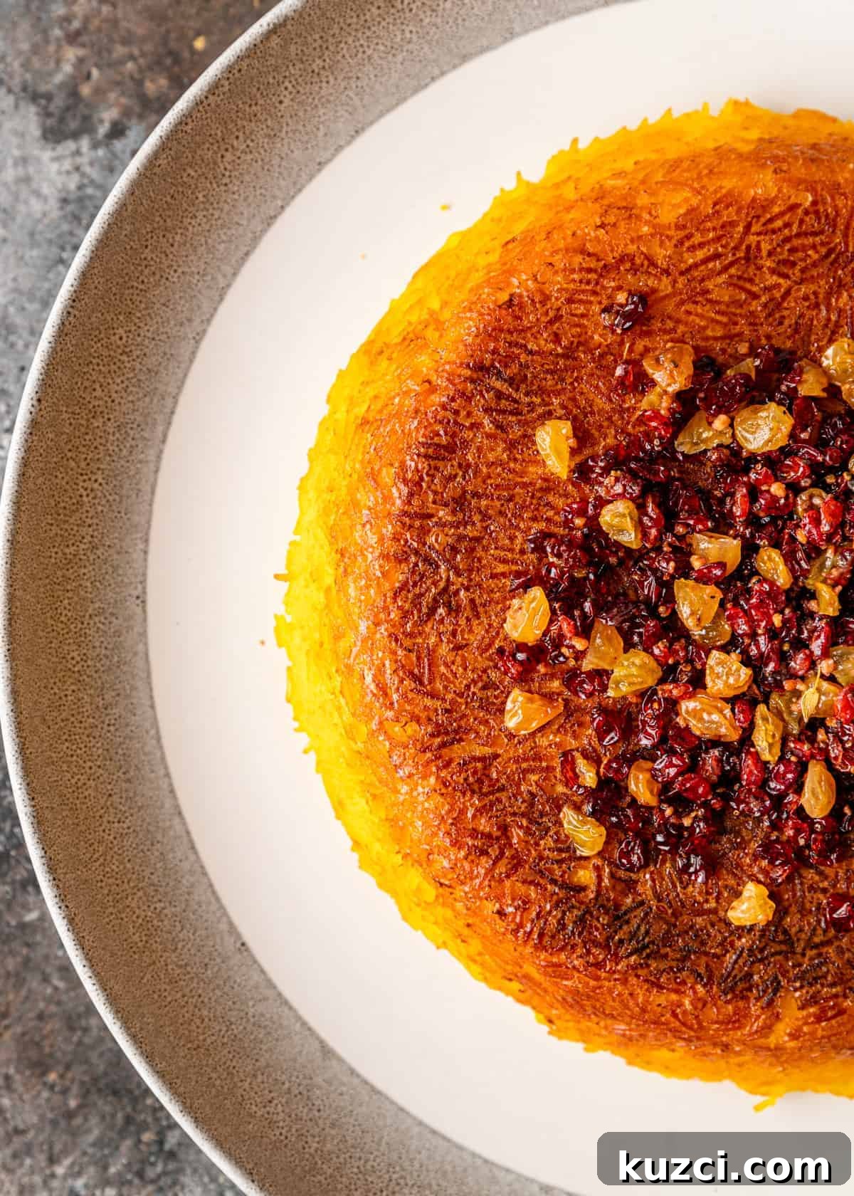 overhead: half of a baked tachin on white platter