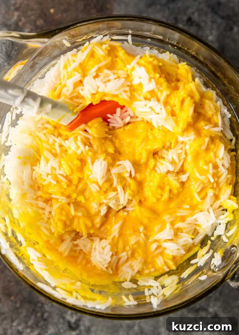 overhead: stirring cooked rice into tachin batter