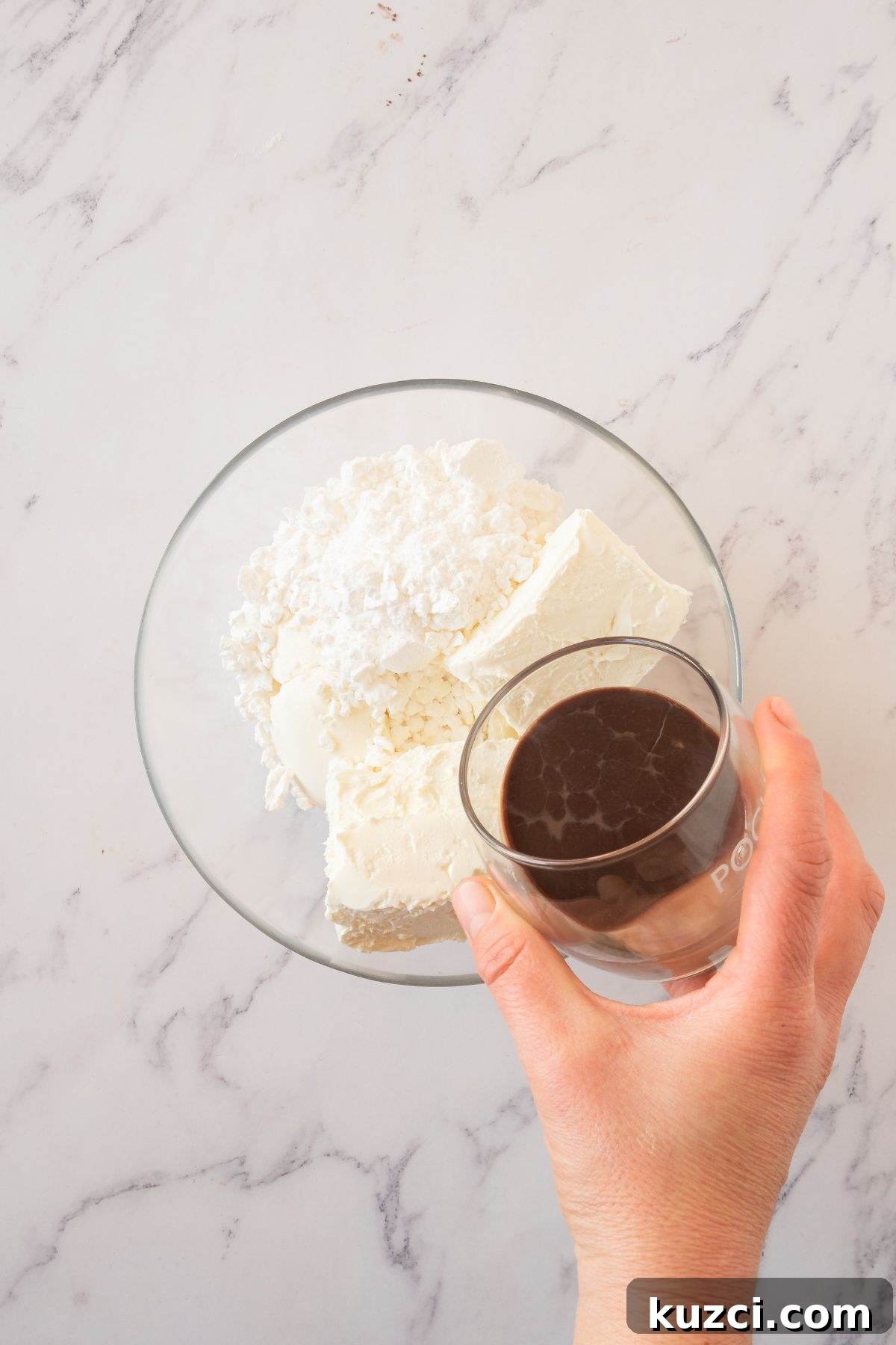 Classic French Crepe Cake (Mille Crepes) Recipe 5 Cheeses being mixed in a clear glass bowl.