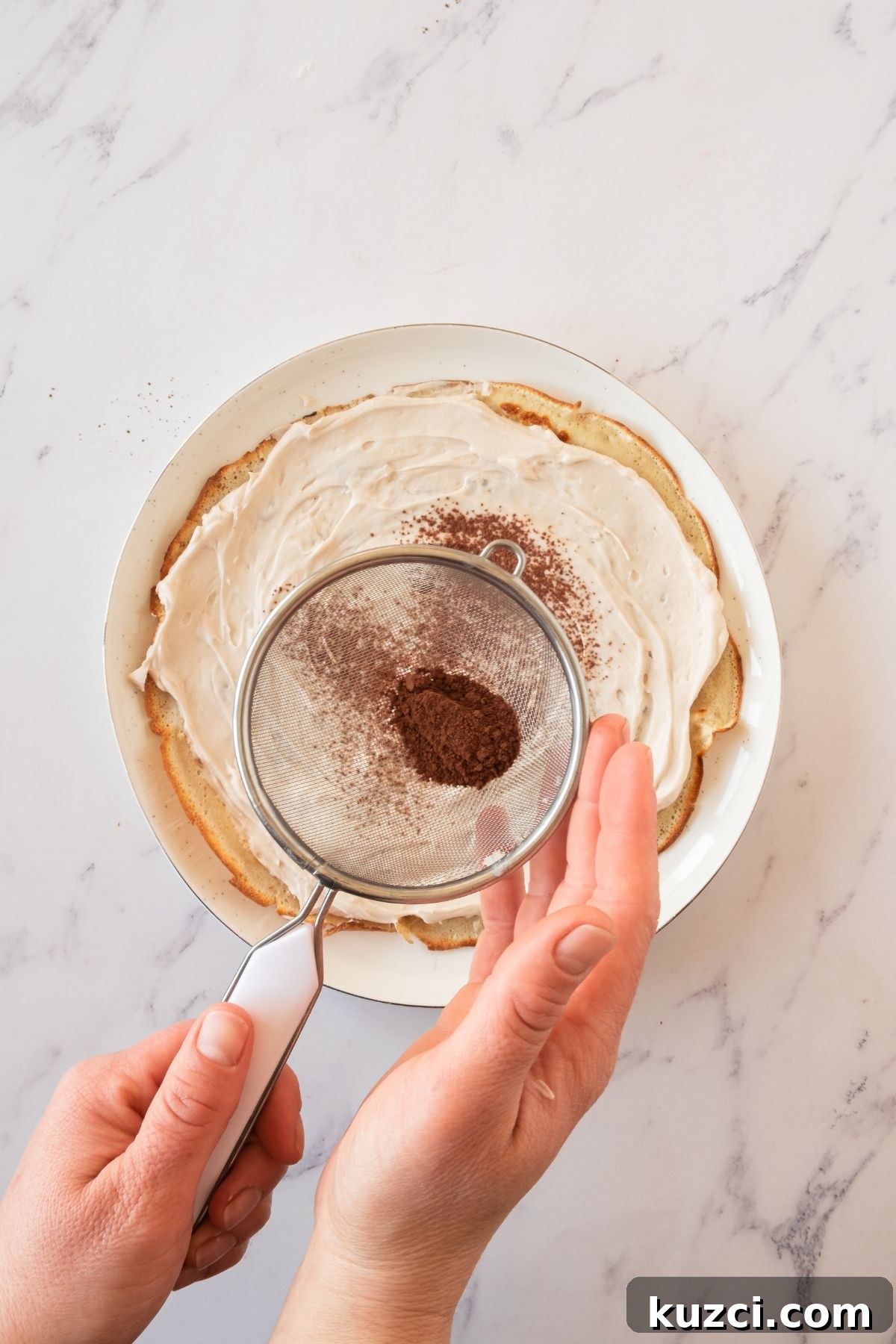 Classic French Crepe Cake (Mille Crepes) Recipe 6 Layers of crepes, topped with mascarpone frosting, then dusted with cocoa powder.