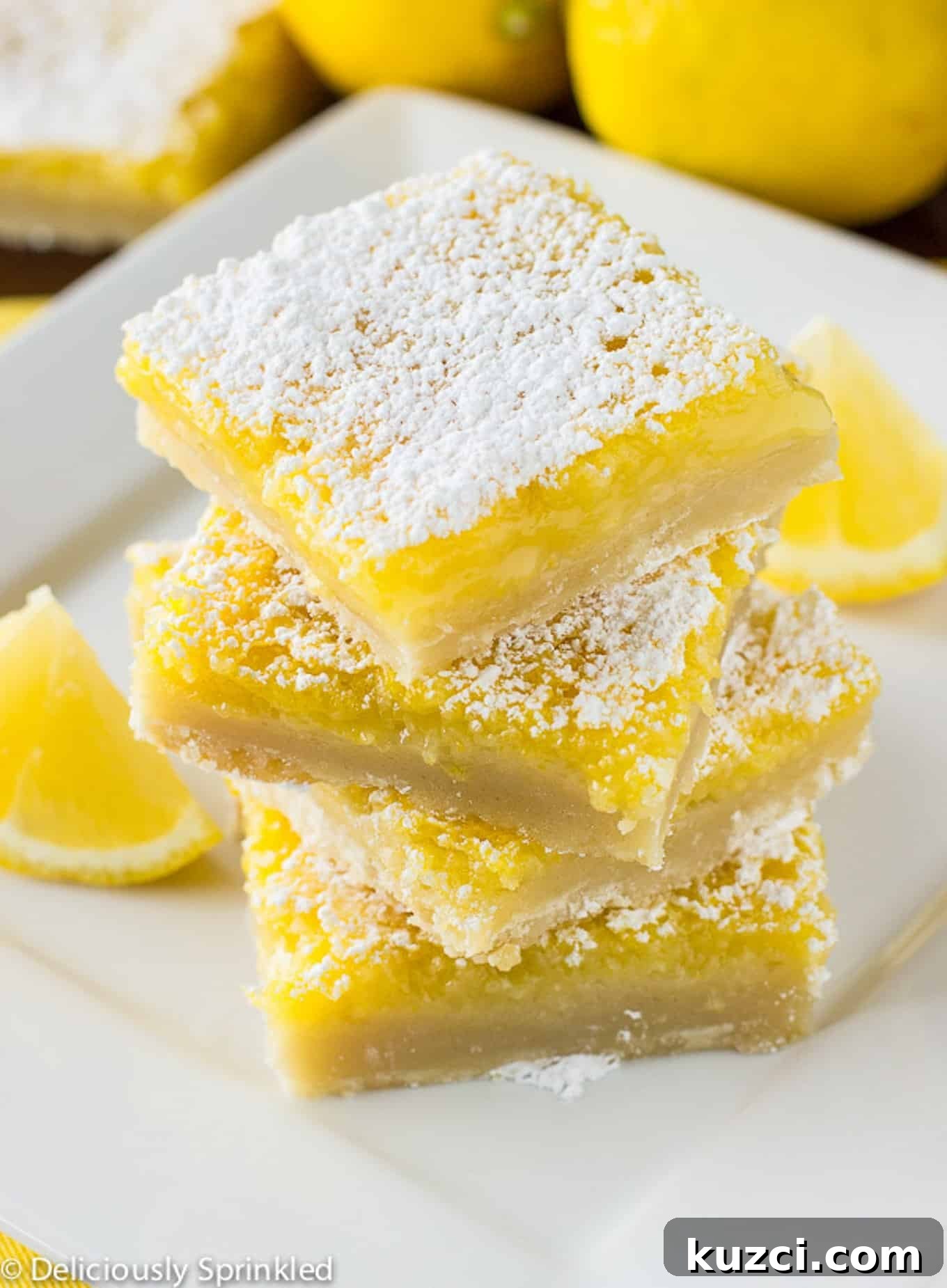 Zesty Lemon Bars Recipe with Buttery Shortbread Crust 9 Stack of tasty lemon bars.