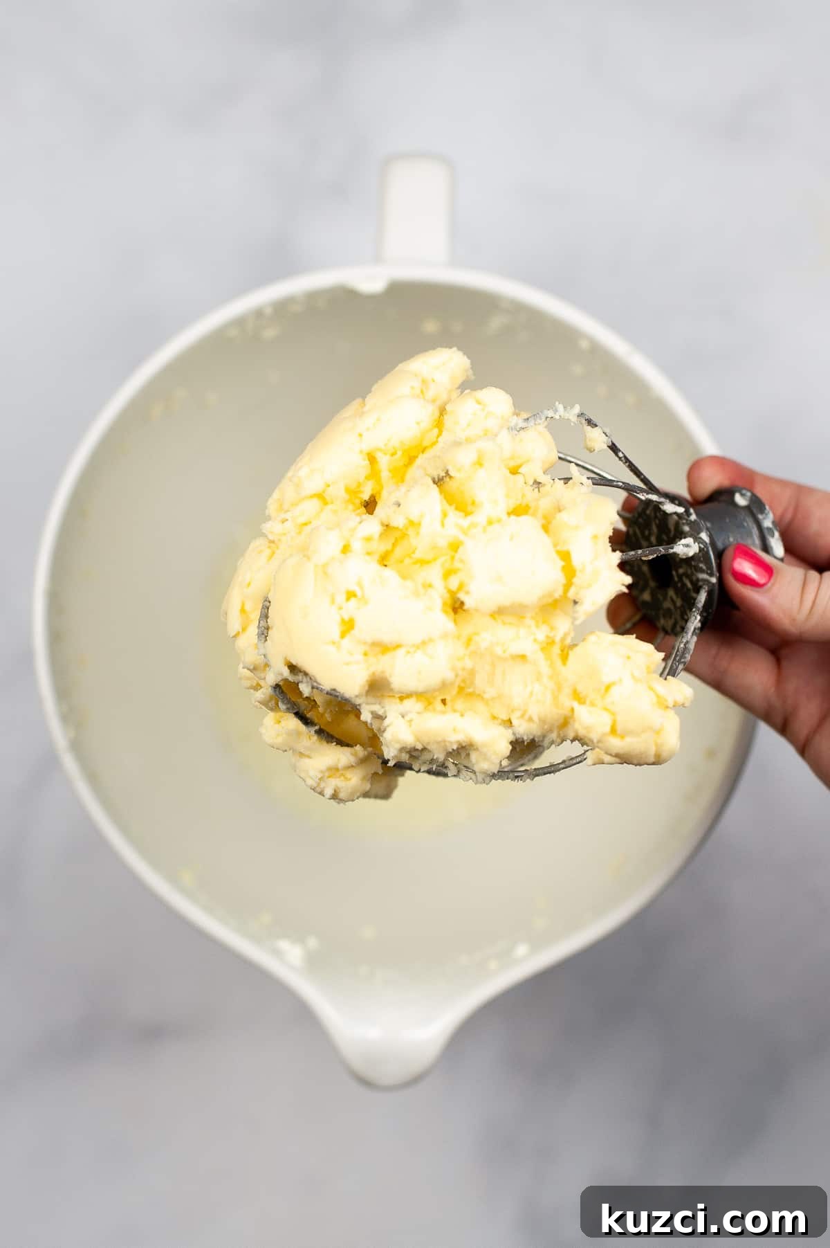 Whisk mixer attachment with glob of butter stuck to it