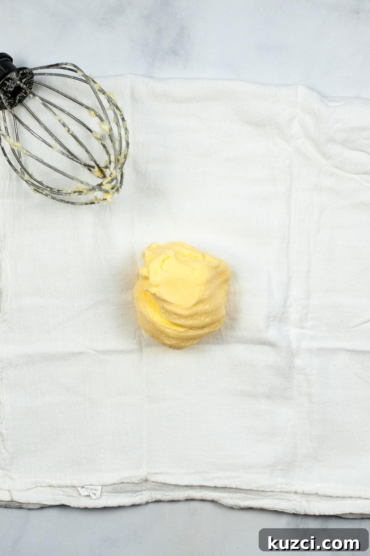Ball of butter in center of cheesecloth