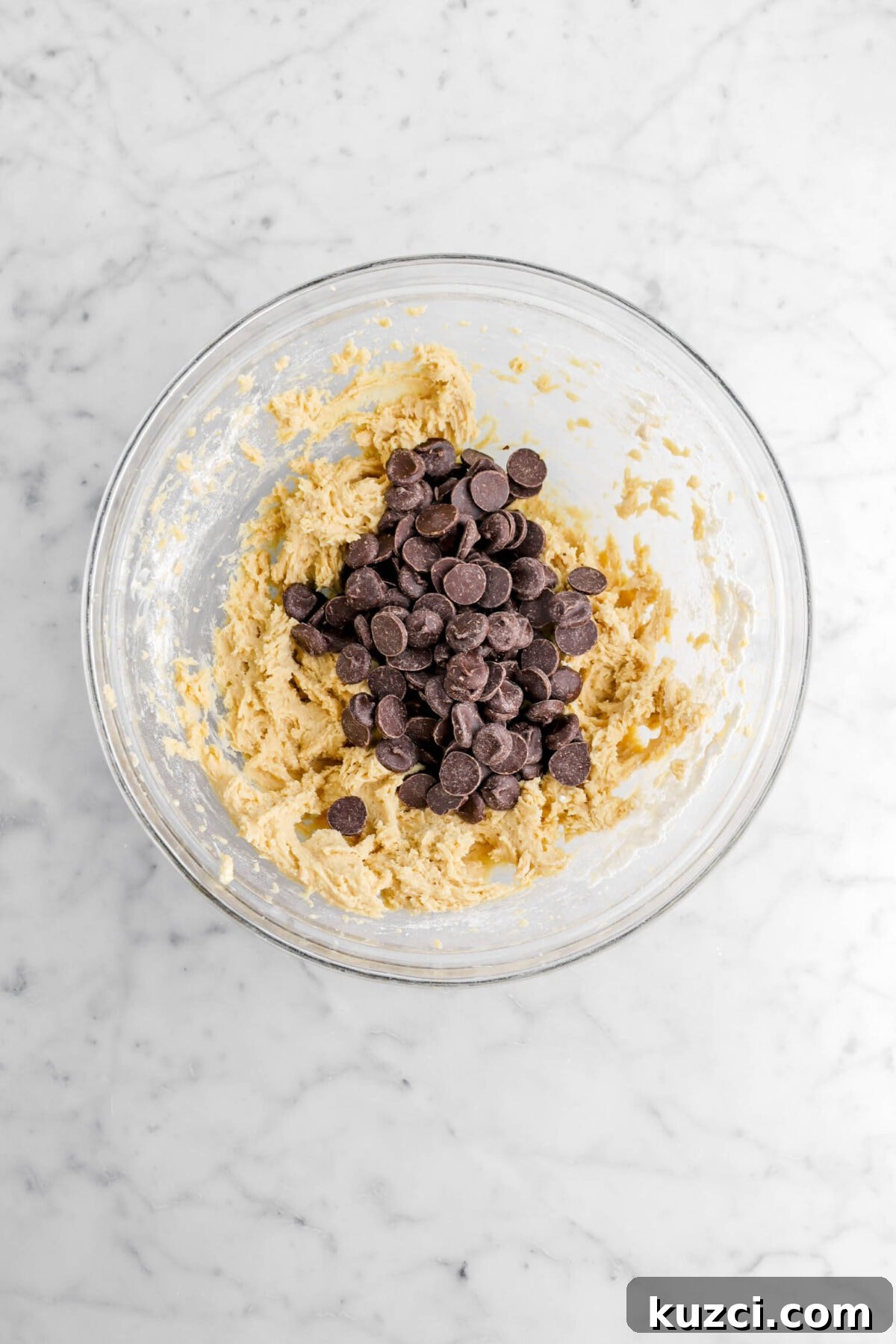 Chocolate Chip Cookie Cake with Chocolate Buttercream 17 chocolate chips added on top of cookie dough.