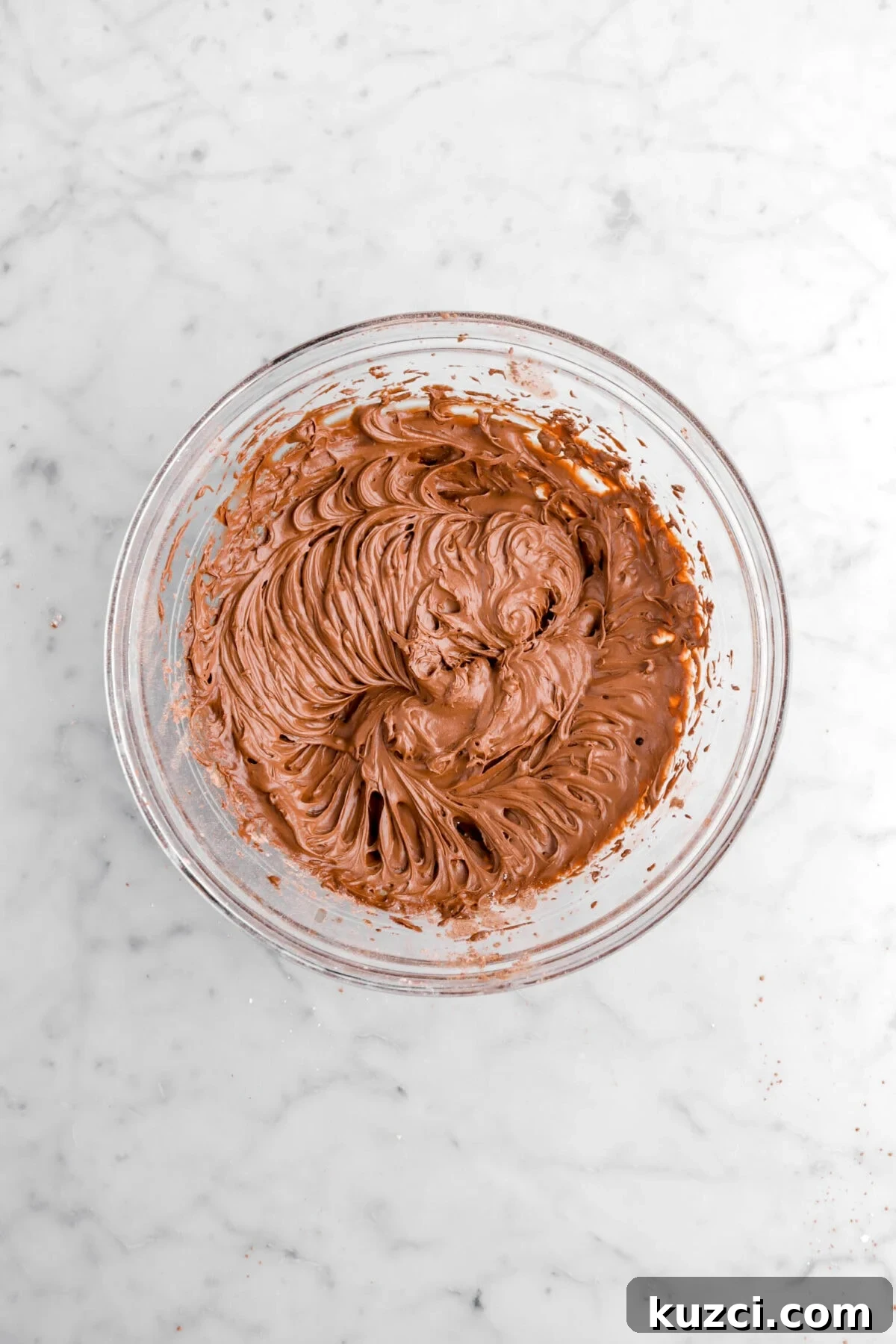 Chocolate Chip Cookie Cake with Chocolate Buttercream 22 chocolate buttercream in glass bowl.