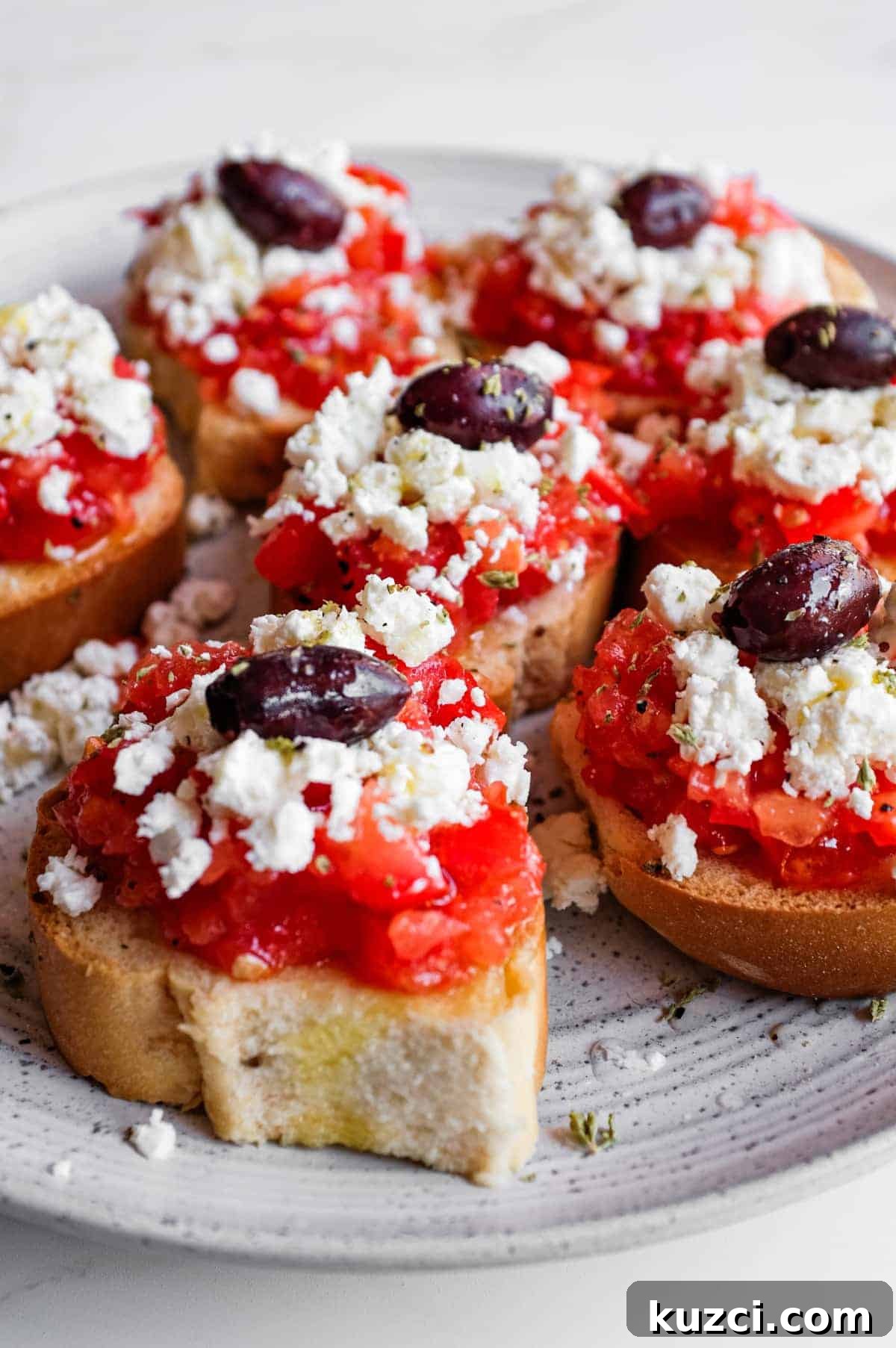 Cretan Dakos Salad | cookeatworld.com Crisp barley rusks loaded with juicy tomato and salty feta cheese