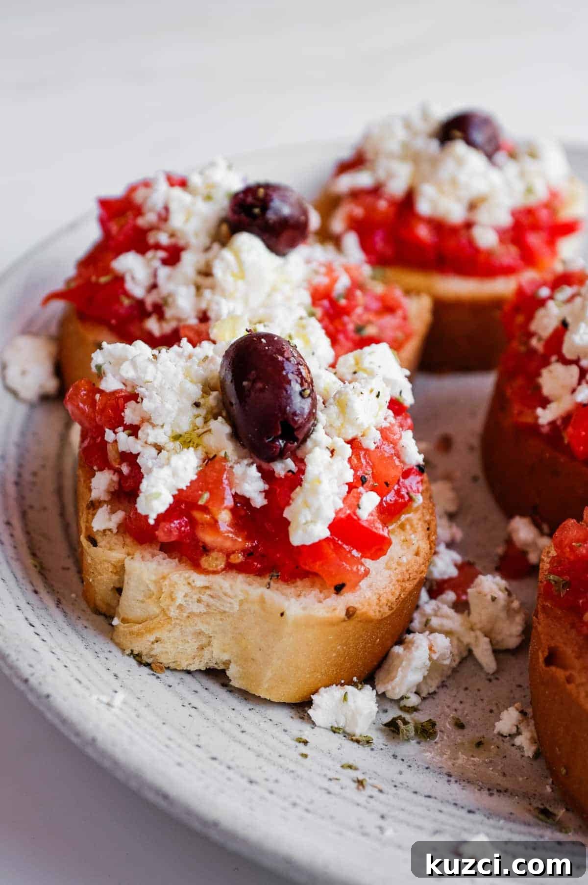 Cretan Dakos Salad | cookeatworld.com Traditional Greek dakos made with paximadia barley rusks and fresh tomato