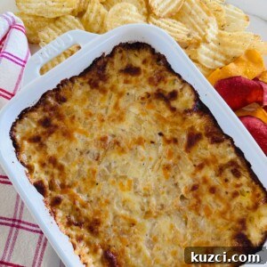 Creamy Baked Onion Dip Recipe with Caramelized Onions 14 Hot onion dip in a baking dish.