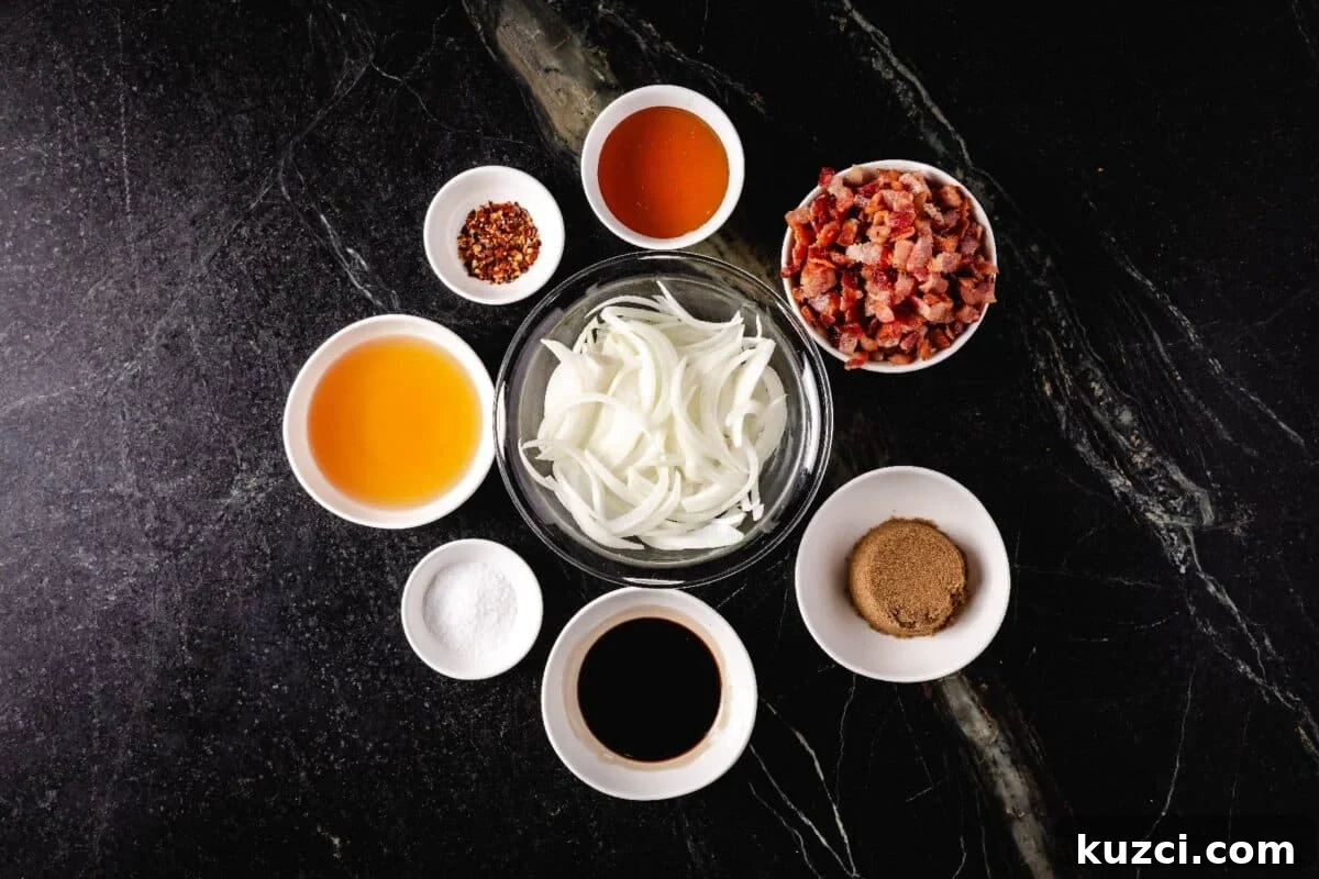 Sliced onions and other raw ingredients in glass bowls on a marble countertop.