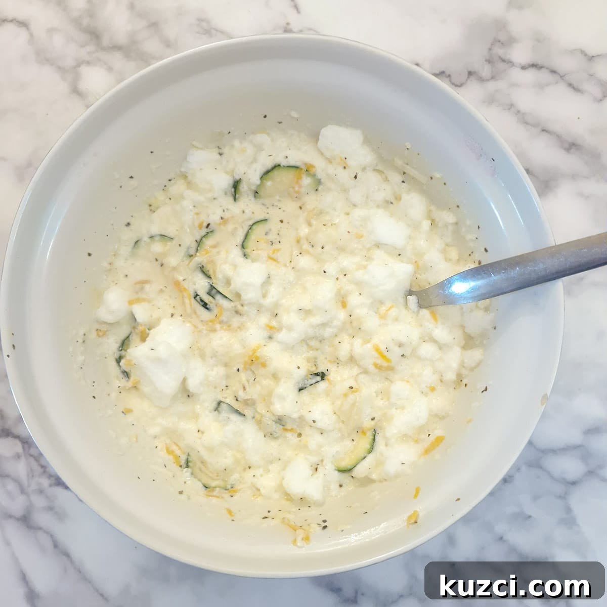 Crustless Cheesy Zucchini and Carrot Quiche 11 Egg whites combined with the quiche filling.