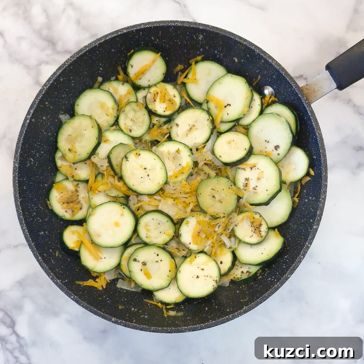Crustless Cheesy Zucchini and Carrot Quiche 6 Sliced zucchini and grated carrots added to the onions.