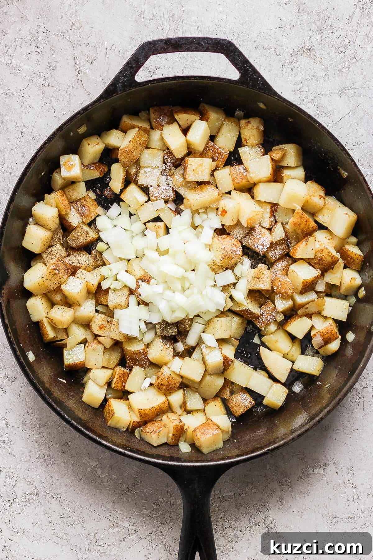 The rest of the onions added to the cooked potatoes, along with the salt and pepper.