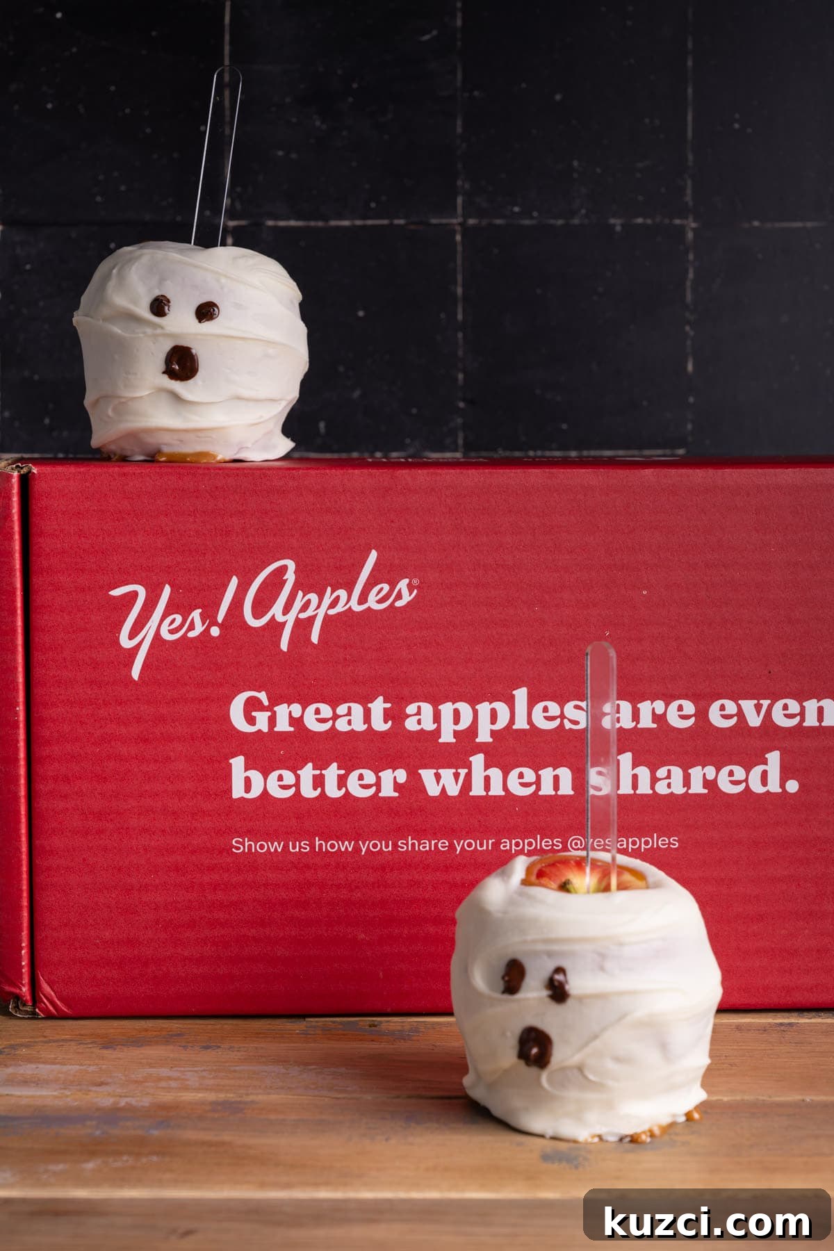 5-Ingredient Halloween Caramel Apples Recipe 11 Two ghost caramel apples with a Yes Apples box.