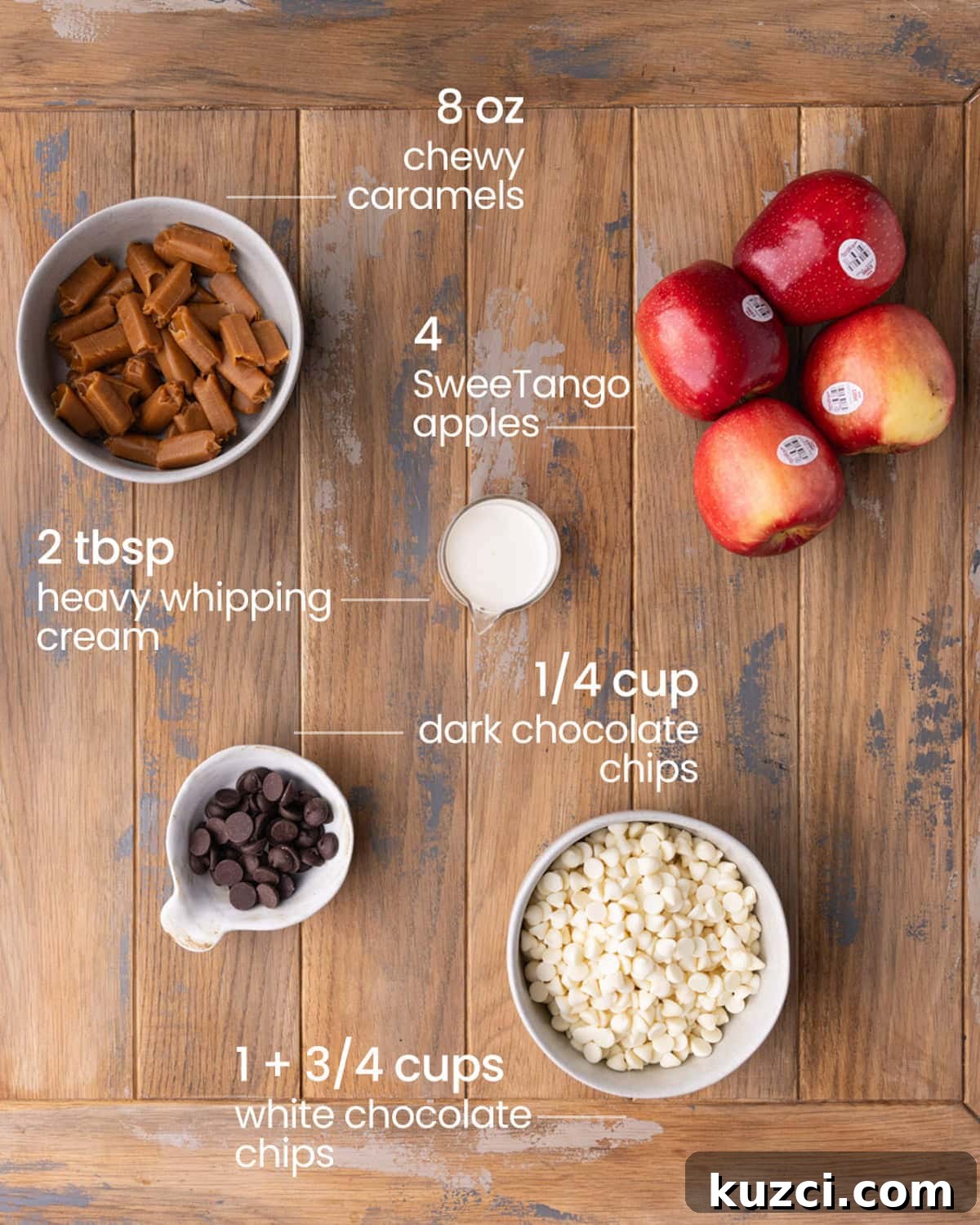 5-Ingredient Halloween Caramel Apples Recipe 3 overhead view of the ingredients for Halloween Caramel Apples - chewy caramels, apples, heavy whipping cream, dark chocolate chips, and white chocolate chips.